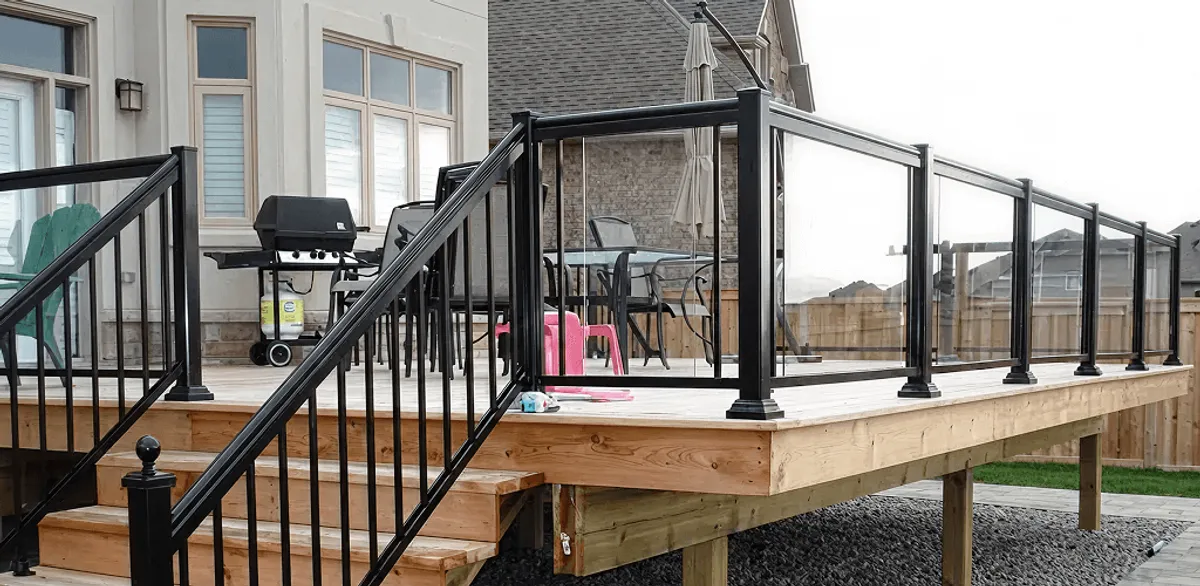 Handrail installation on a deck staircase for safety and code compliance in Kansas City, MO